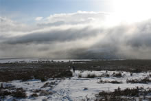 Snow on the moors with low clouds